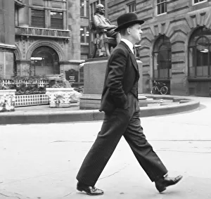 Stockbroker wearing a bowler hat seen here making his way to the Stock Exchange Circa