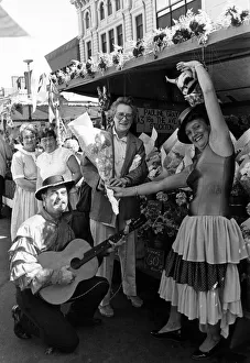 00597 Prints: Stockton Market Fair, Sylvia Old from Thornby is serenaded by stallholders Roy
