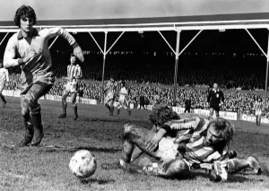 Stoke v. Newcastle. Jimmy Greenhoff lands on top of keeper Mike Mahoney as Glen Keeley