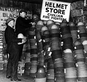 Images Dated 15th September 2015: Storekeepers checking some of the 19, 000 new-type steel helmets which arrived in