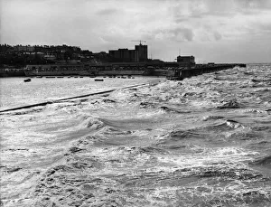 Waves Prints: Stormy night ahead as an angry evening tide lashes the sea wall of Marine Lake in New
