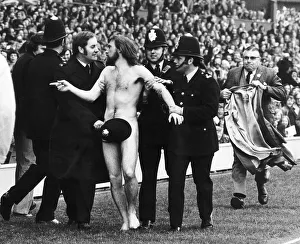 Streaker male nude naked man on pitch at Twickenham police cover him up with hat