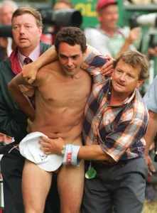 Streaker at the open Golf Championships at Royal Lytham is covered by hat