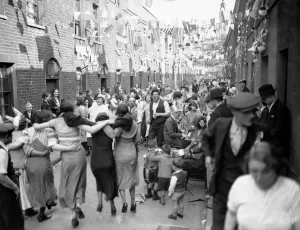 Bunting Prints: Street Party in Londons East End in celebration of King George V Silver Jubilee