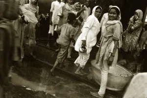 India Prints: A street scene in India - Women going about doing their daily tasks wearing traditional