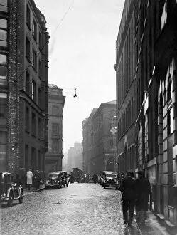 00863 Collection: A street scene in Manchester. 20th December 1934