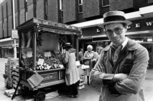 Vegetables Prints: Street trader Albert Sayers wearing a straw boater hat and striped fruit embroidered