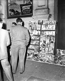 Vendor Prints: Street Vendor selling adult content magazines in West London, 9th May 1956