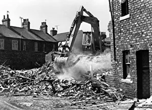 Redevelopment Prints: Some streets being demolished in Carlin How, and bulldozers removing houses