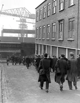 Docks Prints: Their strike over, shipyard men return to work at Wallsend Shipyard in 1957