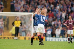 Stuart McCall Rangers football payer gives a Gordon Durie ten after their victory over