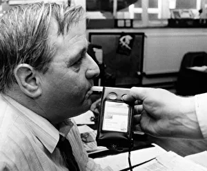 Stuart Minton, News Editor, South Wales Echo Newspaper, tries out a breathalyser test