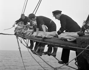 Students attending the Outward Bound Sea School at Aberdovey seen here with one of