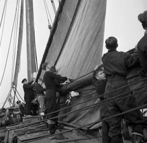 Students attending the Outward Bound Sea School at Aberdovey seen here with one of