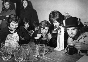 Students of Manchester University of UMIST take part in a beer drinking competition using