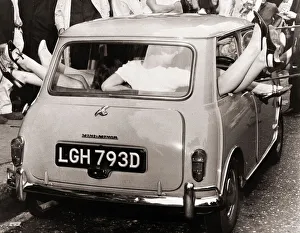 Stunts 13 mini-skirted girls managed to cram into a Mini car