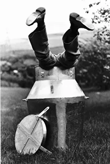 Stuntman Prints: Stunts escapologist David De Val practises in a 12 gallon container filled with beer d