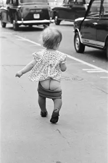 Toddler Prints: The most subtle form of Mooning demonstrated by 17 month old Sarah who lets it all hang