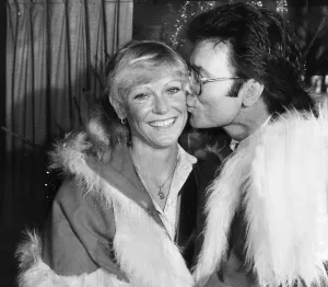 Sue Barker and Cliff Richard kissing at Variety Club event - December 1983