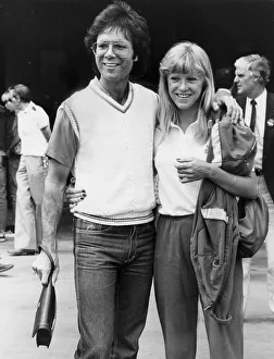 Sue Barker and Cliff Richard walking arm in arm during Wimbledon tournament - June 1983