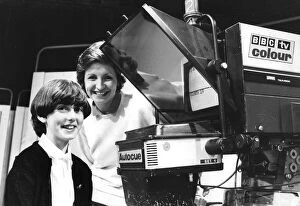 01428 Collection: Sue Lawley with schoolgirl in BBC TV studio showing her the autocue - December 1980