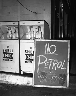 Signs Prints: Suez Crisis 1956 A billboard outside a petrol station vividly demonstrates