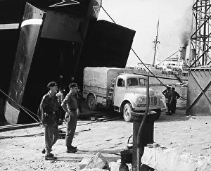 Egypt Prints: Suez Crisis 1956 British equipment coming ashore in Port Said