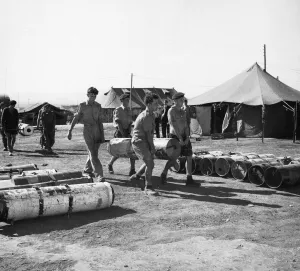 Suez Crisis 1956 British Paratroopers in Cyprus loading canisters with equipment to