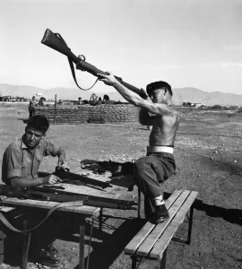 Suez Crisis 1956 British soldiers clean their weapons on an airfield in Cyprus