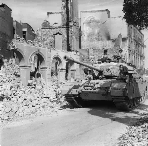 Suez Crisis 1956 A Centurion tank lends support to Commando troops who are carrying