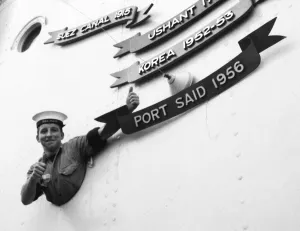 Suez Crisis 1956 Junior Seaman John Higgins, 17, of Oldham gives a thumbs up as