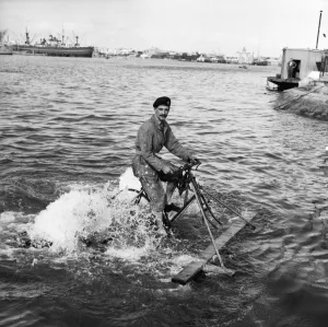 Suez Crisis 1956 Liet John Young crossing Port Said harbour on a pedal bike raft