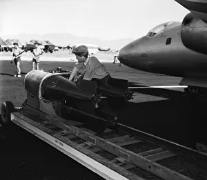Suez Crisis 1956 RAF ground crew loading bombs onto Canberras on an airfield in