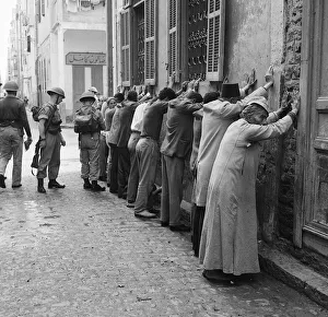 Suez Crisis 1956 Troops assisted by CID officers from Cyprus search Arab Town