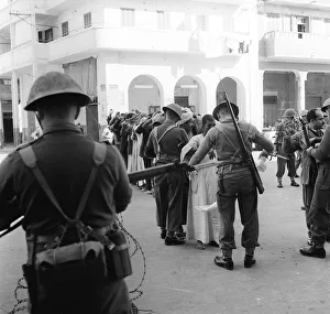 Suez Crisis 1956 Troops assisted by CID officers from Cyprus search Arab Town