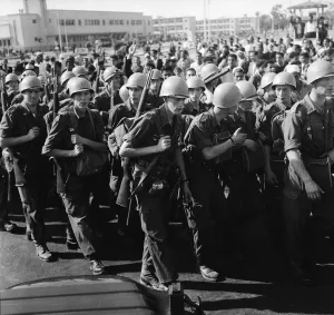 Suez Crisis 1956 United Nations troops march into Port Said past a restless