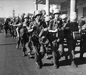 Suez Crisis 1956 United Nations troops march into Port Said past a restless
