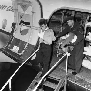 Suez Crisis 1956 A wounded British soldier is helped off an ambulance aircraft