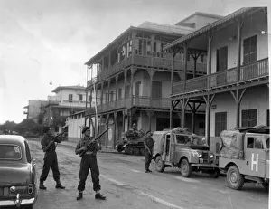 Land Rover Prints: The Suez crisis - Troops on the alert for snipers as the army convoys drive through