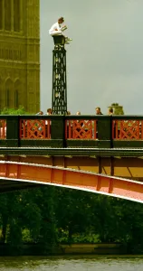 Bridge Prints: Suicide attempt on Lambeth bridge a woman attempting suicide sits on top of a light over