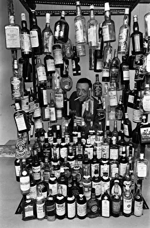 Whiskey Prints: Sunday Mirror writer Stanley Shivas with the 137 best selling Scottish whiskeys