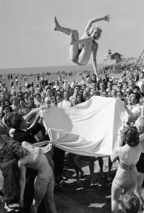 Sunday Pictorial 1957 Beach Party. Angela Manselle seen here being giving the bumps