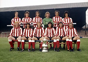 The Sunderland FA Cup winning team pose with the trophy at their Roker Park ground