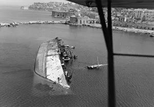 A sunken enemy ship lies in the harbour of Gaeta on the west coast of Italy near Rome