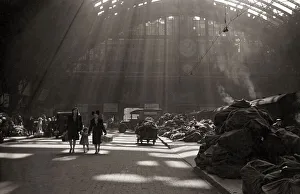 Light Prints: Sunlight filters through the roof of St. Pancras station London England during the war
