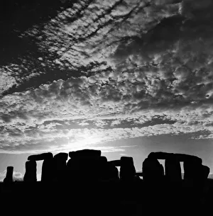 Clouds Prints: Sunset over Stonehenge in Wiltshire Britain Sunset Silhouette Clouds Druids Country Scene