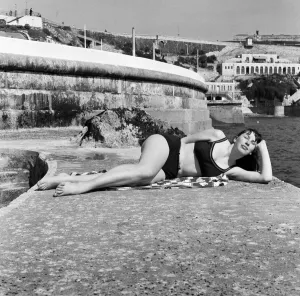 Sunshine as warm as summer shines in Plymouth, Devon. Schoolgirl Felicity Kutt, 15