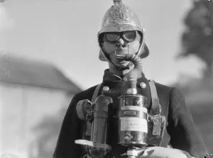 00080 Prints: Surbiton Fire Brigade Display. October 1933 A fireman wearing smoke apparatus