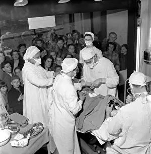 Surgical operation and how a operating theatre works is demonstrated to members of