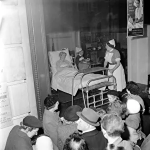Surgery Prints: Surgical operation and how a operating theatre works is demonstrated to members of